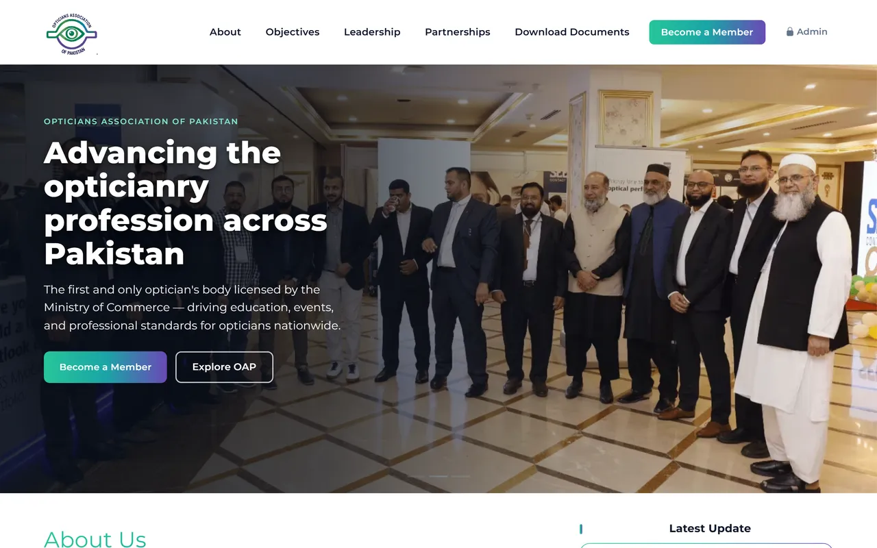 The Opticians Association of Pakistan homepage: a hero photograph of the association’s members, an about section, and a core-objectives grid.
